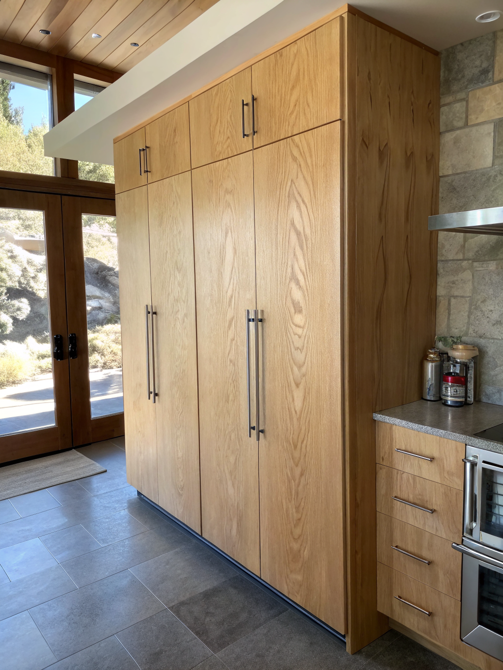 Custom floor-to-ceiling shaker style pantry installation with immaculate finish